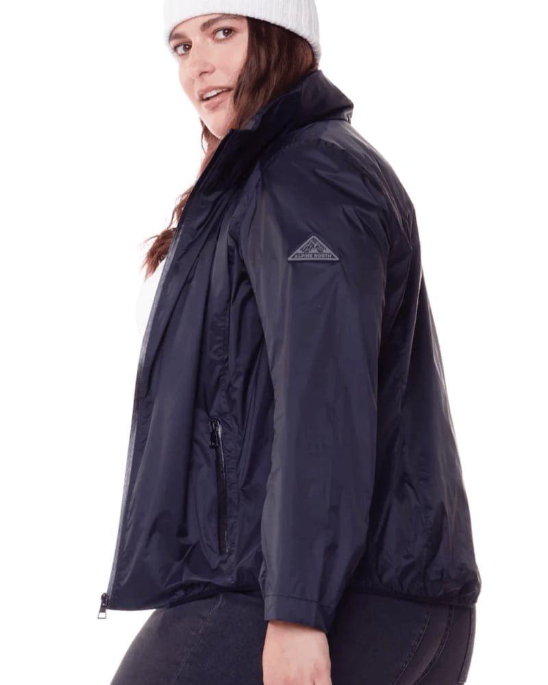 Side of a model wearing a size 2X Ultralight Windshell Jacket in BLACK by Alpine North. | dia_product_style_image_id:279154